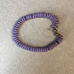 A light purple and dark purple bracelet